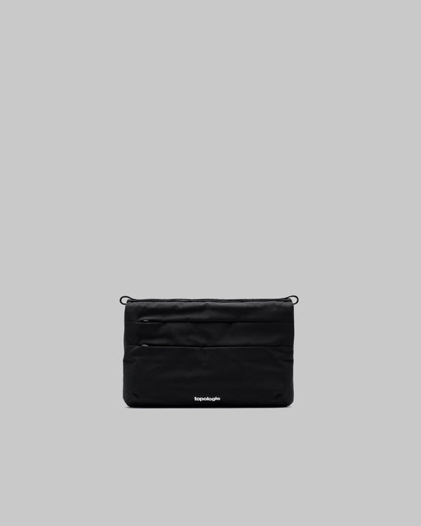 Black pouch with a brand logo on a gray background